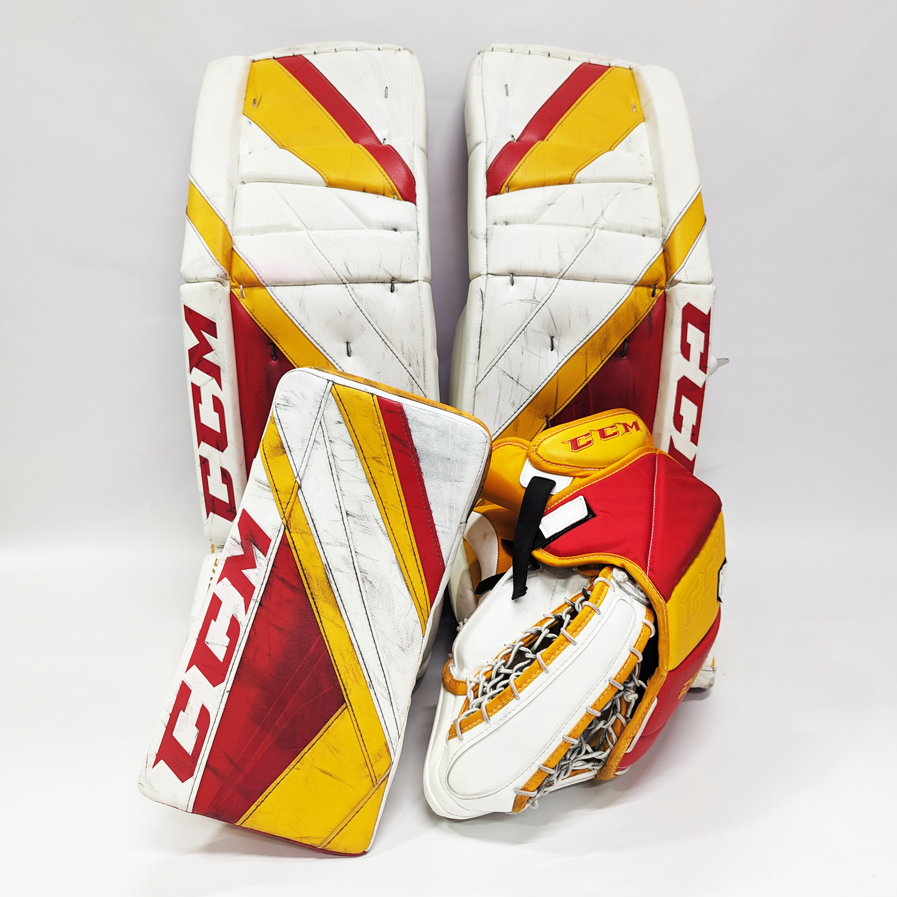 CCM Extreme Flex 5 - Jambières de gardien de but AHL Pro Stock d'occasion (blanc/rouge/jaune)